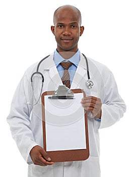 This clipboard is reserved for your copy space. A young doctor holding up a blank clipboard reserved for copyspace.