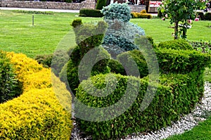 Clipped plants in the park in the shape of animals