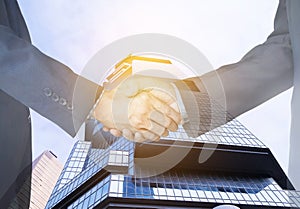 clipping path, Businessmen shaking hands on city background. Double exposure. coworker concept.