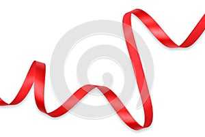 Clipping path. Top viewFlat lay of Shiny red ribbon rolled isolated on ehite background view. Ribbon roll decorative object