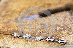 Cloceup jeweller at work silver soldering