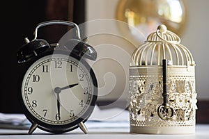 Alarm clock and keys on a light background