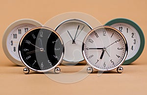 clock. Beautiful modern clock lies on paper background. time clock time standstill time off work working with time time