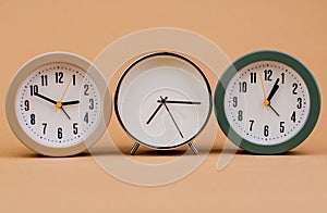 clock. Beautiful modern clock lies on paper background. time clock time standstill time off work working with time time