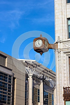 Clock on the corner of historic building in Washington DC.