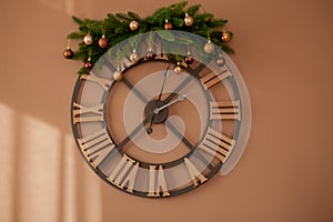 The clock is decorated with Christmas toys