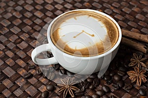 clock drawing on latte art coffee cup