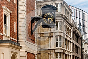 Clock on a facade of a building of London, England