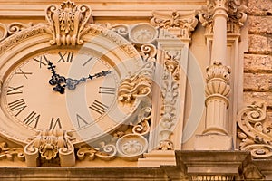 Clock on the facade of Santa Maria de Montserrat Abbey, Spain