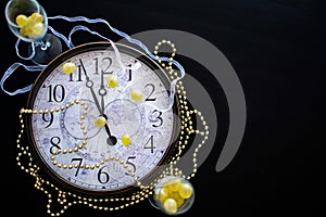 A clock face about to strike midnight on new years eve in Spain