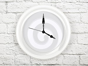 Clock without figures hanging on a brick wall