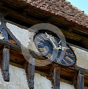 Clock. Fortified medieval saxon evangelic church in Veseud, Zied, Transilvania, Romania