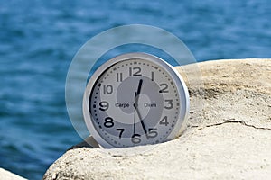 Clock in front of blue sea