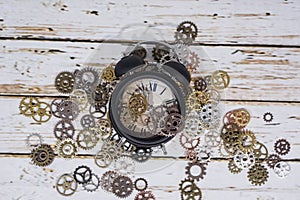 Clock gear wheels on table. Retro clock repairing abstract photo