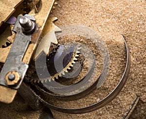 Clock gears in sand