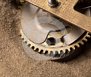 Clock gears in sand