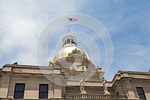 Clock Gold Dome and American Flag on City Hall