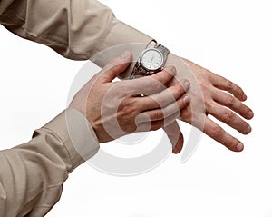 Clock on a hand on a white background