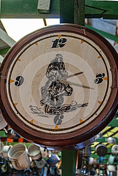 Clock with indigenous figure at Posada Estancia Rio Verde, Riesco Island,, Chile