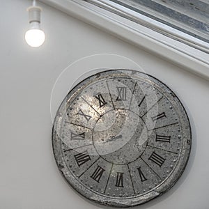 Clock and light bulb hanging