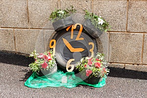 Clock made with car tires and flowers on Costitx en Flor (Costitx in bloom) Flower Fair