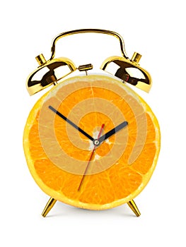 Clock made of orange fruit