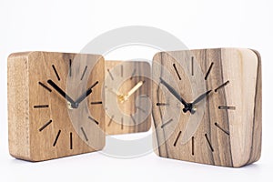 Clock made of wood. Clock face in loft style. Designer Scandinavian watch. On a white background