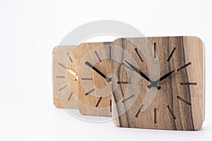 Clock made of wood. Clock face in loft style. Designer Scandinavian watch. On a white background