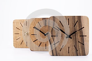 Clock made of wood. Clock face in loft style. Designer Scandinavian watch. On a white background