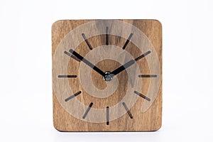Clock made of wood. Clock face in loft style. Designer Scandinavian watch. On a white background