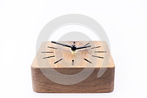 Clock made of wood. Clock face in loft style. Designer Scandinavian watch. On a white background