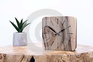 Clock made of wood. Clock face in loft style. Designer Scandinavian watch. On a white background