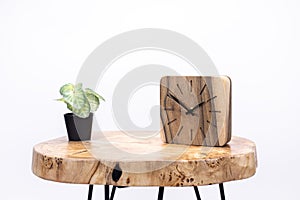 Clock made of wood. Clock face in loft style. Designer Scandinavian watch. On a white background