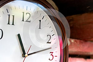 A clock with 11 and 11 on it. Obsolete Round wall clock. time concept