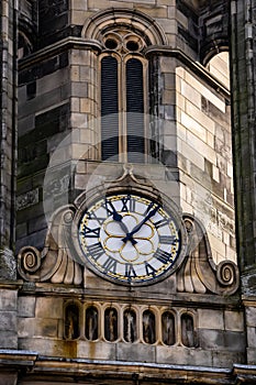 Clock on old stone architecture on the Royal Mile in Edinburgh, Scotland, UK