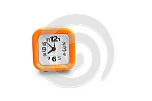 Clock orange with white backdrop.Orange clock on a white backgr