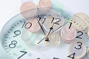 Clock over euro money with double exposure