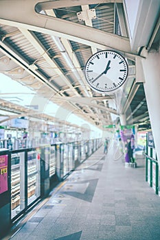 Clock at railway station. - Vintage color tone.