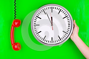 Clock and red telephone