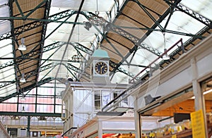 clock and roof inside Cardiff market