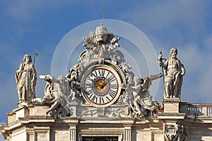 Clock with sculptures at Saint Peter basilica in Vatican