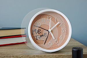 Clock on a shelf with an inscription me time.