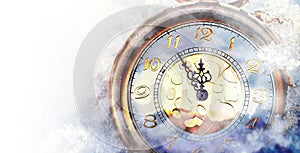 Clock showing five minutes to twelve. Time to stop and realize the values of life and painting effect photo