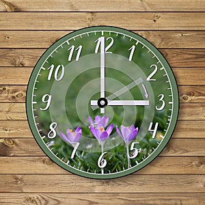 The clock shows the hand moving forward from 2 a.m. in winter to 3 a.m. in spring.