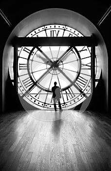 Clock with a silhouette of a man, b&w image