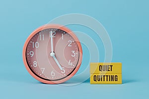 clock striking five and text quiet quitting