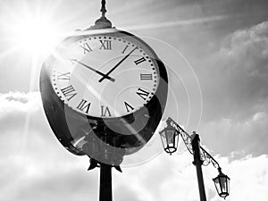 Clock in sunshine, bw