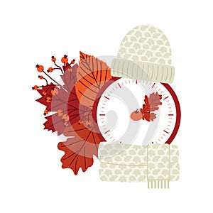 Clock switch to winter time. Daylight saving time ends. A clocks in a floral frame of autumn orange foliage and turning