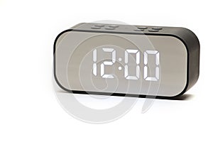 Clock with a time of 12 hours 00 minutes on a white background