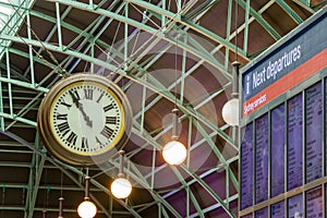 Clock and timetable in Sydney central train station.